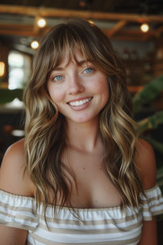 Long beachy waves with bangs, creating a relaxed and playful hairstyle. Beachy Waves, Tap