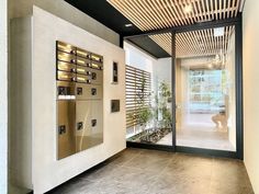 the inside of a building with several mailboxes on it's walls and doors