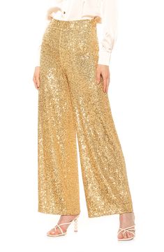 Sparkling sequins bring dazzling allure to a pair of stretch pants that are elevated by a wide leg and mid rise. Banded waist  Invisible back zipper 90% polyester, 10% spandex; lining content: 100% polyester Hand wash cold, lay flat to dry Imported Model stats: 5'10", 32" bust, 25" waist, 36" hip. Model is wearing size S. Sequin Pant, Perfect Cocktail Dress, Gold Pants, Sequin Pants, Bell Bottom Pants, Medium Dress, Small Dress, Slim Pants, Drop Shipping