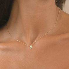 Elevate your everyday style with our exquisite Initial Tag Necklace, available in 14k gold filled, sterling silver, or 14k rose gold filled options. Personalize your look with your choice of initials, beautifully crafted into a sleek and modern tag pendant. Handcrafted with care, this necklace is perfect for adding a touch of elegance to any outfit, whether you're dressing up for a special occasion or adding a chic accent to your casual wear. Each necklace comes with a delicate chain that comple Dainty Gold Initial Necklace, Minimalist 14k Gold Filled Birth Flower Jewelry, Minimalist 14k Gold Filled Initial Necklace Gift, Minimalist 14k Gold Filled Jewelry As Gift For Mom, Minimalist 14k Gold Jewelry Gift For Mom, Minimalist 14k Gold Filled Jewelry For Mom, Dainty Hypoallergenic Initial Pendant Jewelry, Minimalist 14k Gold Filled Initial Necklace, Rose Gold 14k Gold Filled Charm Necklace For Gift