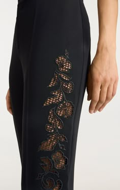 Experience the perfect balance of style and comfort with our Cutout Paisley Embellished Kerry Pant. Made from Drapey Crepe fabric, these straight leg trousers feature an eye-catching Cutout Paisley detail along the side of the leg. Elevate your look and add a touch of unique flair to any outfit with these statement pants! Details Zipper fly and button closureFabric: Drapey CrepeStraight legCut Out Paisley detailsFull length Content and Care 69% Triacetate 31% PolyesterDry Clean OnlyImported Meas Embellishments On Fabric, Zipper Fashion Detail, Embroidery Haute Couture Details, Embellished Pants, Embellishments Fashion, Statement Pants, Embroidery Fashion Detail, Design Pants, Embellished Skirt