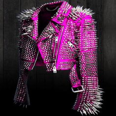 Make a statement with this stunning pink leather jacket! 🎀 Perfect for parties and showing off your chic punk style, this jacket is studded and spiked with silver accents. 🔥 Available in all sizes, this bomber jacket has a zip and buckle closure and is made of high-quality leather. 🙌 Get ready to turn heads and rock your style! #PinkLeatherJacket #Studded #PunkStyle #Spikes #BomberJacket #AllSizesAvailable Spiked Leather Jacket, Steampunk Mode, Purple Leather Jacket, Bold Outfits, Gothic Jackets, Punk Women, Women Motorcycle, Leather Jacket Women, Pink Leather Jacket