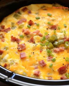 a casserole with ham, cheese and green onions in it is ready to be eaten