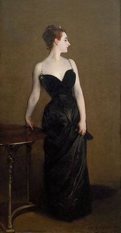 a painting of a woman in a black dress standing next to a table with a vase on it