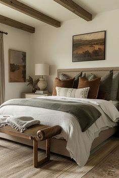 a large bed sitting in a bedroom next to a window