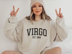 Custom Virgo Crewneck Sweatshirt - perfect birthday gift for the Virgo zodiac sign. This sweatshirt is soft, comfortable, and versatile, making it the perfect choice for any cold day. COLORS: White, Sand, Sport Grey, Navy, Pink, Forest Green HOW TO ORDER: * Please check and review all photos. * Select your Size and the Color that you want from the drop-down bar. * Add your personalization. * Click Add to Cart and check out. SIZING: * Unisex sizing. Loose fit.  Runs true to size. * Please make su Virgo Birthday, Virgo Zodiac Sign, Birthday Sweatshirt, Pink Forest, September Birthday, Astrology Gift, Zodiac Astrology, Virgo Zodiac, Gemini Zodiac