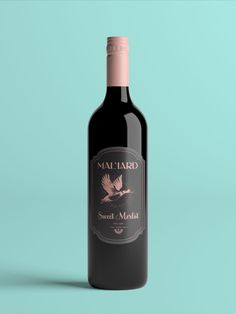 a bottle of red wine with a bird on the label that says mataad sweet make