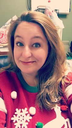 a woman in a red and white christmas sweater