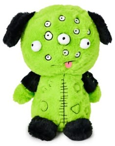 a green stuffed animal with big eyes on it's face and black ears,