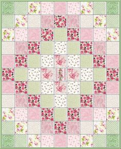 a pink and green quilt with flowers on it