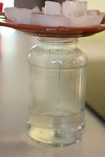 a glass jar filled with liquid sitting on top of a table