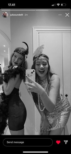 two women dressed in costumes taking a selfie