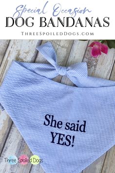 a dog bandana with the words she said yes on it and a pink flower