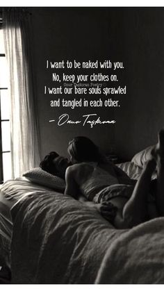 a woman laying on top of a bed next to a window with a quote above it