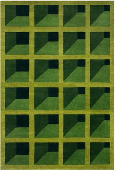 a green rug with black squares on it