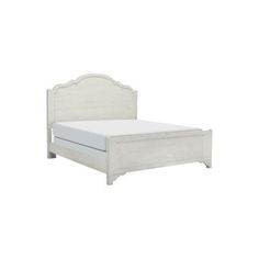 a white bed with a wooden headboard and foot board