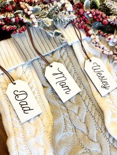 three tags that say good and bad hang on sweaters with flowers in the background