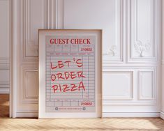 a poster with the words guest check written on it in front of a white wall