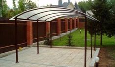 an outdoor covered patio area next to a brick building