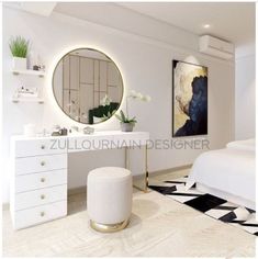 a bedroom with white furniture and a large mirror on the wall