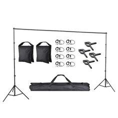 a set of photography equipment including sunglasses, umbrellas and tripod lights on a white background