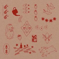 a bunch of different designs on a piece of brown paper with red ink in it