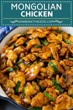 chicken with sauce and green onions in a white bowl on a blue checkered table cloth