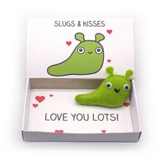 a green slug in a box with the word love you lots