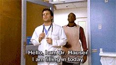 two men in scrubs are standing in an elevator with the caption hello, i am dr hauser i am filling in today