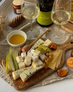 wine glasses and cheese on a table