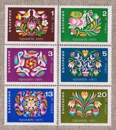 four stamps with different designs on them, including flowers and numbers in the middle one