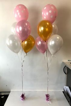 some balloons that are in the shape of minnie mouses