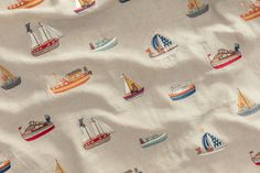 a white fabric with boats and ships on it