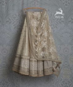 "\"Get the perfect look of traditional and glamour with this stunning beige-colored lehenga choli. Show off your great taste in art with the intricate thread details on the whole lehenga. Pair this beige color net base dupatta and blouse set. \" Colors: Beige Fabric: Soft Net Shape: Flared Lehenga ---->What is semi stitched Product?️Semi stitched lehenga means that the pattern of the lehenga is ready and only the fitting of the lehenga as per your waist and height(waist to floor) has to be done. Net Lehenga Choli, Langa Voni, Lehenga Choli Designs, Lehenga Choli For Women, Choli For Women, Kids Lehenga, Lehenga Wedding, Net Lehenga, Red Lehenga