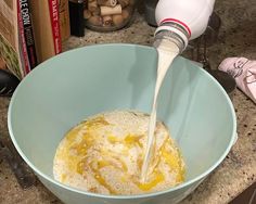 a mixing bowl filled with batter and eggs