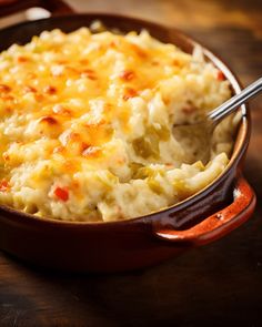 a casserole dish with mashed potatoes and vegetables