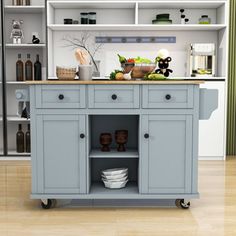 a kitchen island with lots of dishes on it