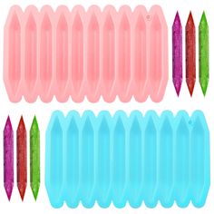 several different shapes of plastic toothbrushes on a white background, with one being pink and the other is blue