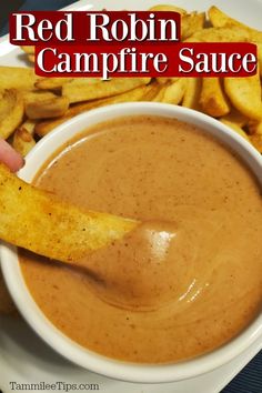 red robin campfire sauce in a white bowl next to french fries on a plate