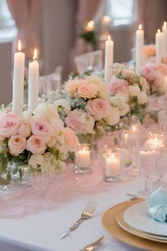 the table is set with candles, flowers and napkins for an elegant wedding reception