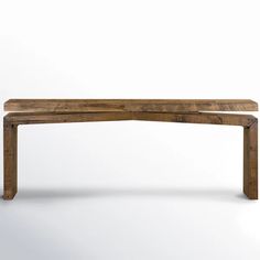 a wooden bench sitting on top of a white floor