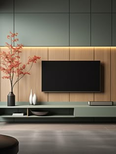 a modern living room with an entertainment center and vases on the wall, in front of a flat screen tv