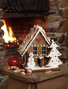 a gingerbread house decorated with icing and decorations