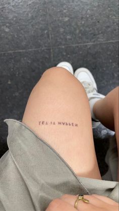 a woman's leg with the words, feli is modern written on it