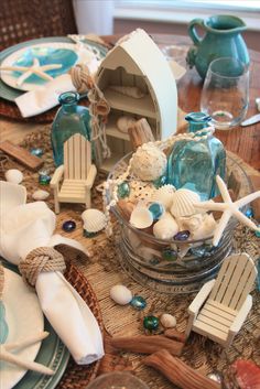 the table is set with seashells and shells