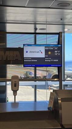 an airport check in counter with the view of the ocean