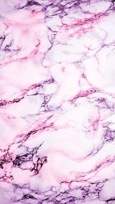 the marble is pink and white with black streaks