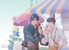 two men standing next to each other eating icecream in front of an umbrella