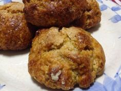 three muffins on a blue and white plate