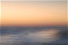 the sky is reflected in the water as it looks like waves are coming up from the ocean